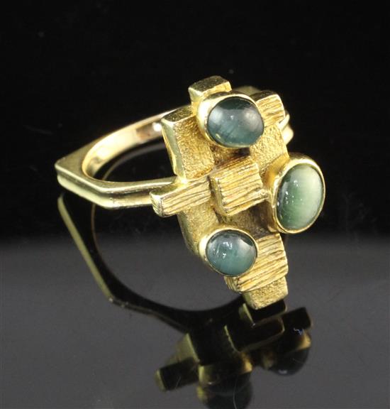 A stylish 1970s? 18ct gold and cats eye chrysoberyl ring, size O.